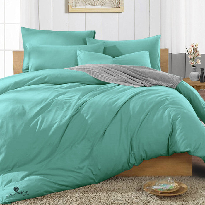Aqua green duvet cover styled on a bed