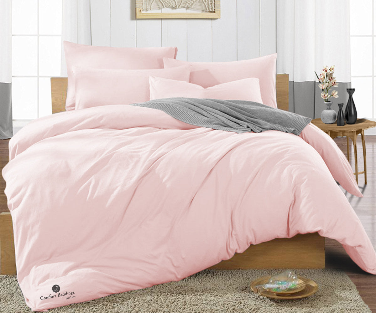 Blush duvet cover on a neatly made bed