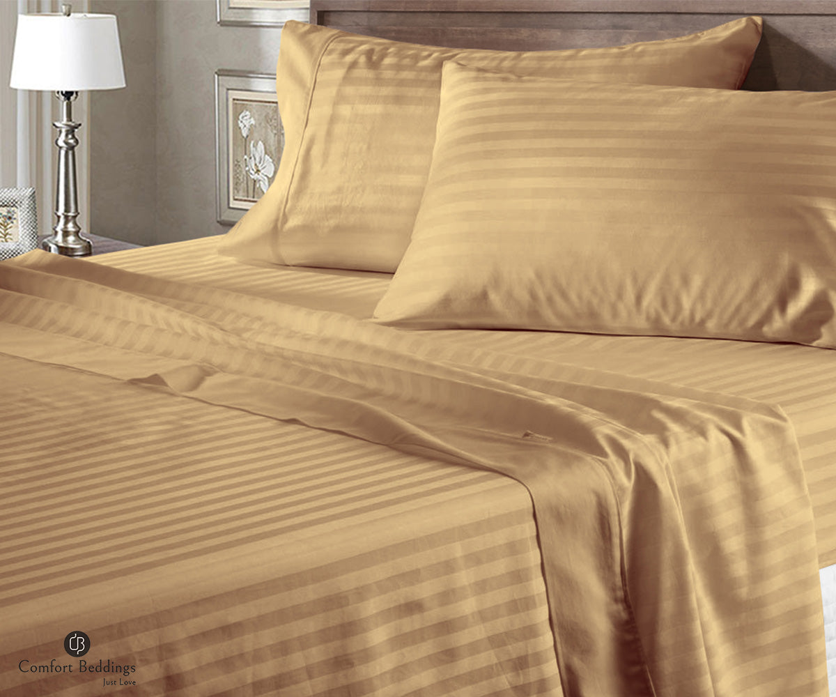 Taupe stripe cotton bed sheets on a bed for monsoon season