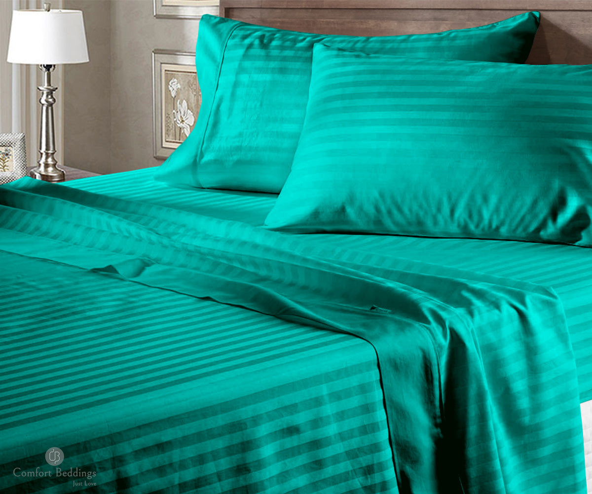 Neatly made bed with cotton bedding and pillows