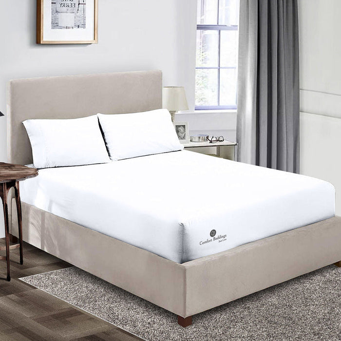 Light colored bedsheets in a small bright bedroom setup